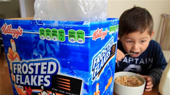 Child eating Frosted Flakes Cereal